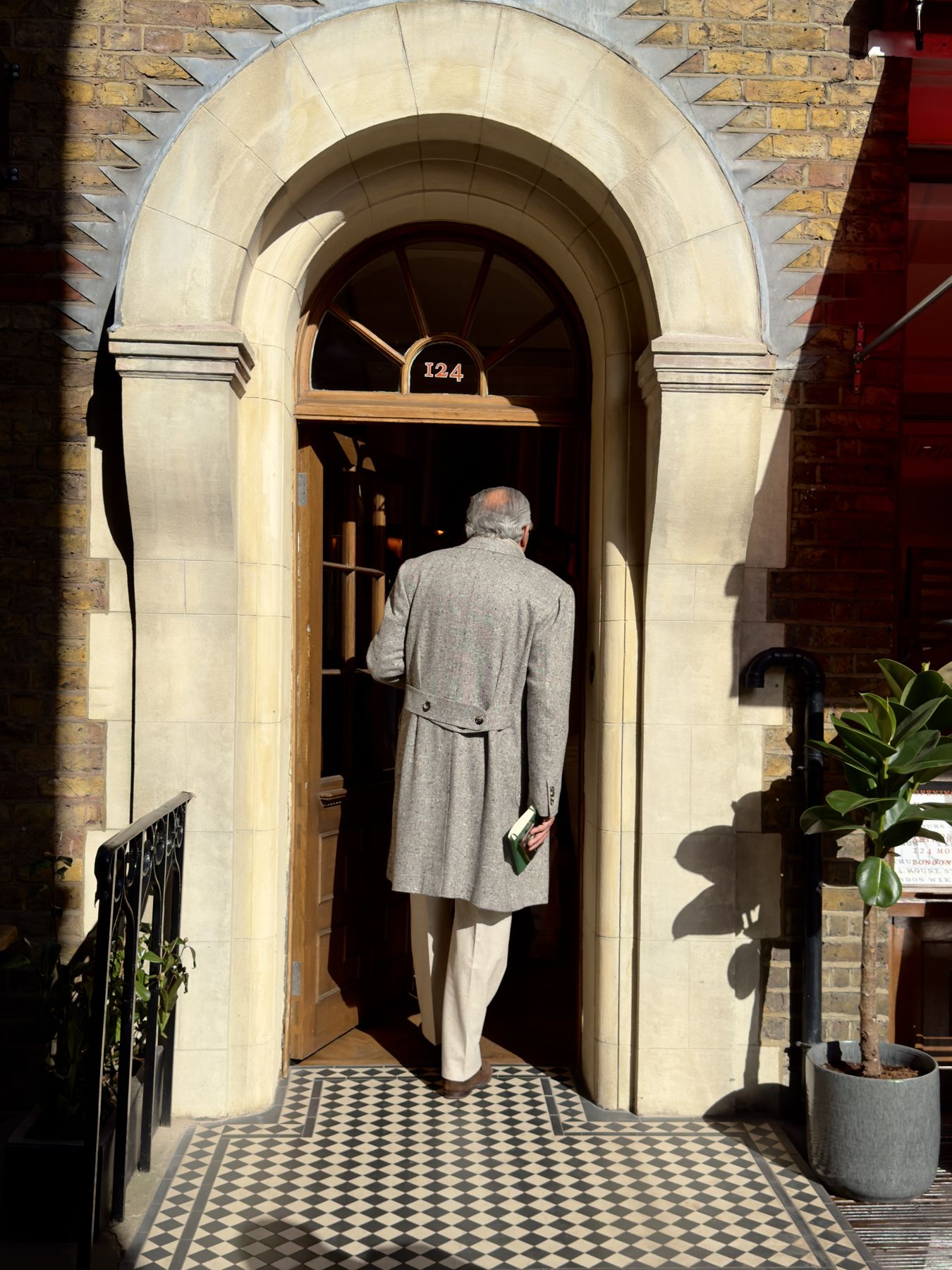 Walking in under the arch at number 124
