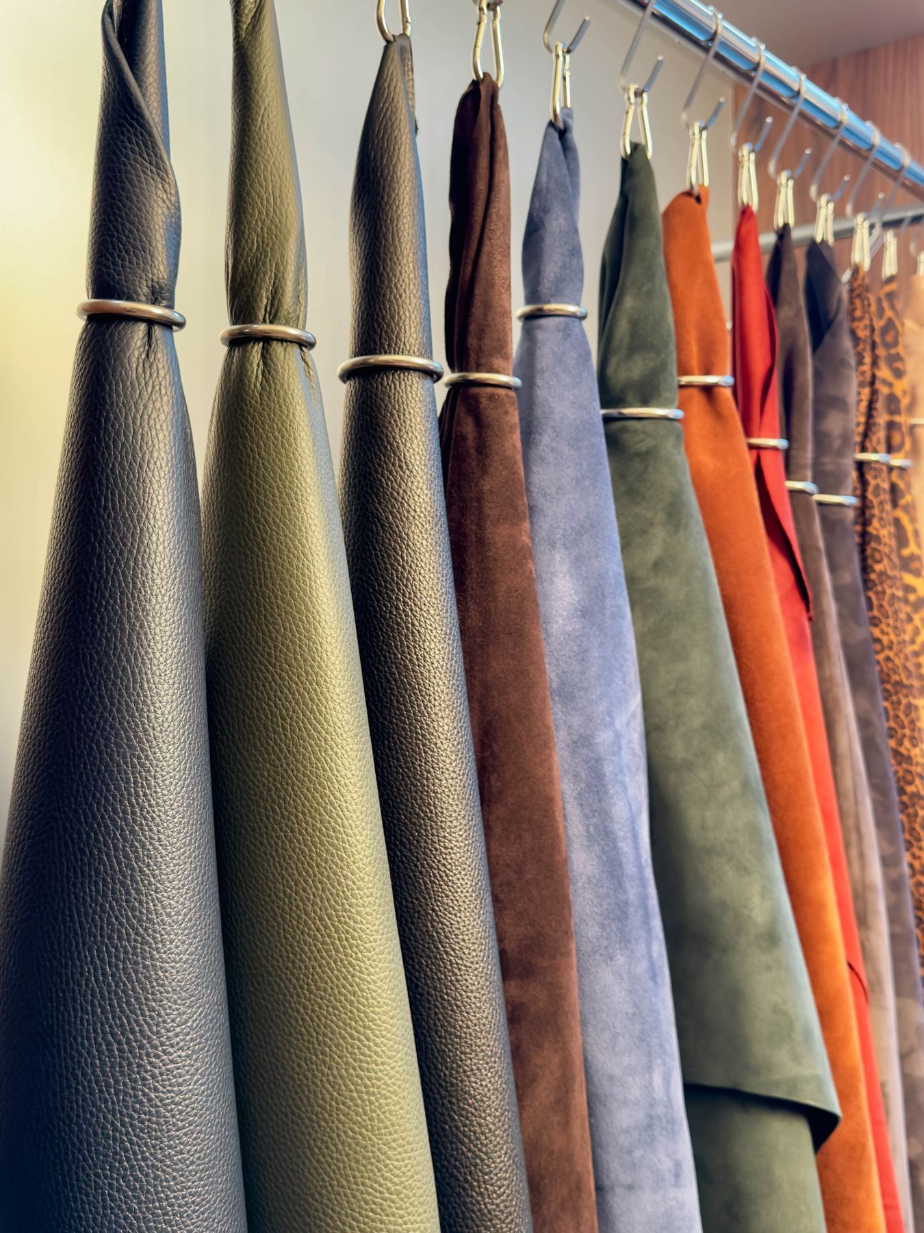 The leathers, hanging in the factory